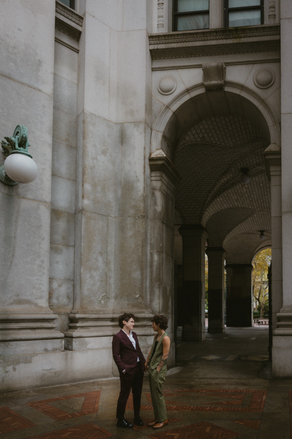 Katie and Anna under a stone archway